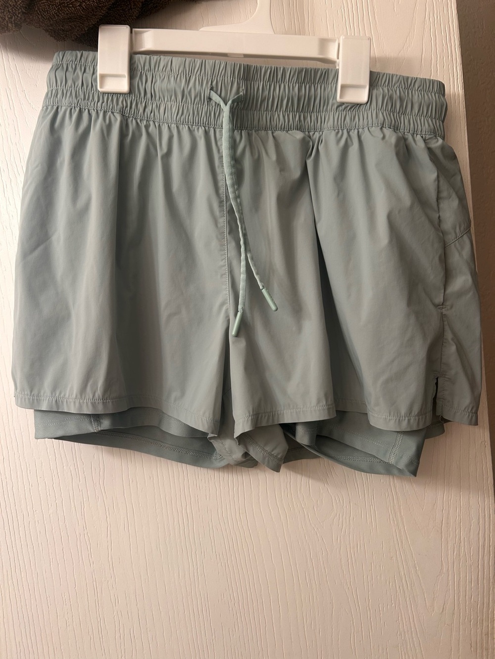 Spyder Women’s Athletic Shorts with built in biker shorts in Light Sage